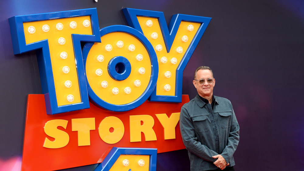 Tom Hanks posing on Toy Story 4 red carpet