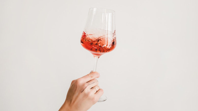 Woman holding glass of wine