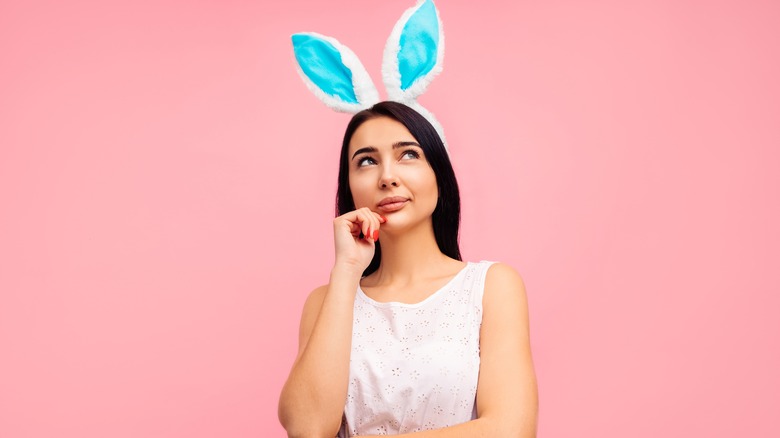 Woman wearing blue Easter bunny ears 