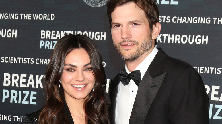 Mila Kunis and Ashton Kutcher pose for photos at the 9th Breakthrough Prize Ceremony Arrivals at the Academy Museum of Motion Pictures in Los Angeles (2023)