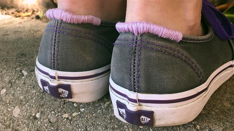 Faded Vans sneakers with purple accent