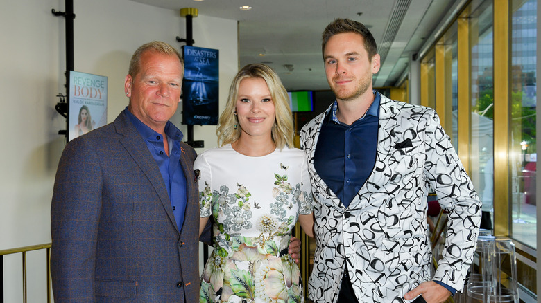 Mike Holmes posing with his two kids