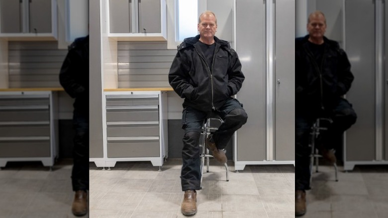 Mike Holmes posing in workshop