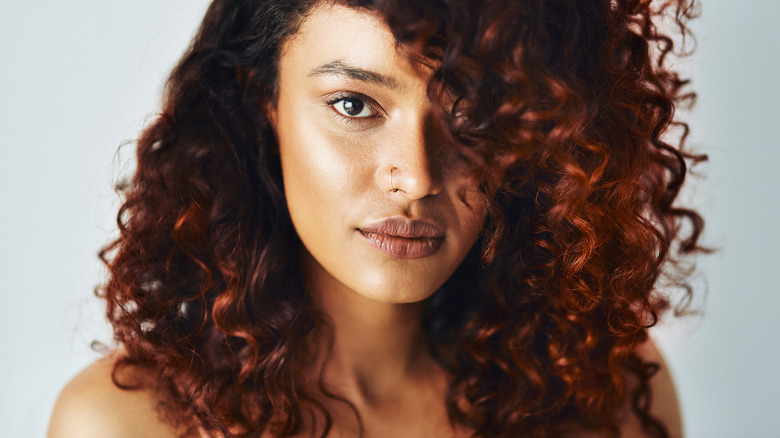 model with dark coper red hair