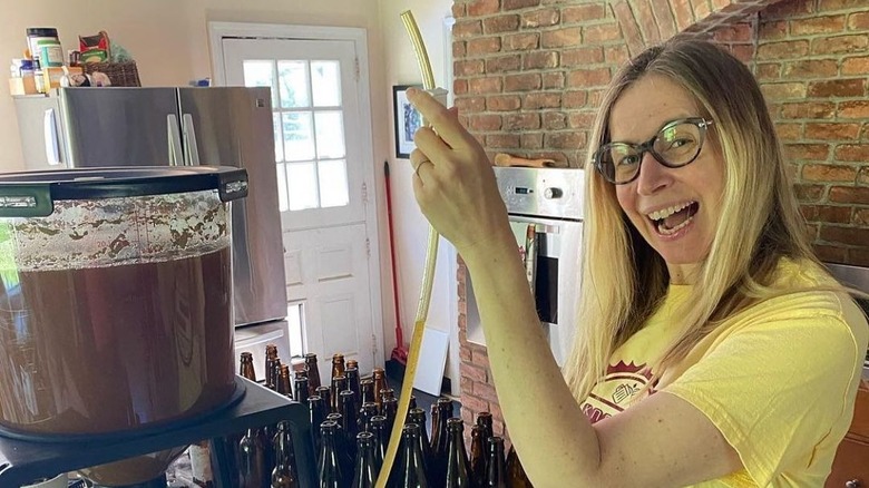 Woman using a beer brewing kit