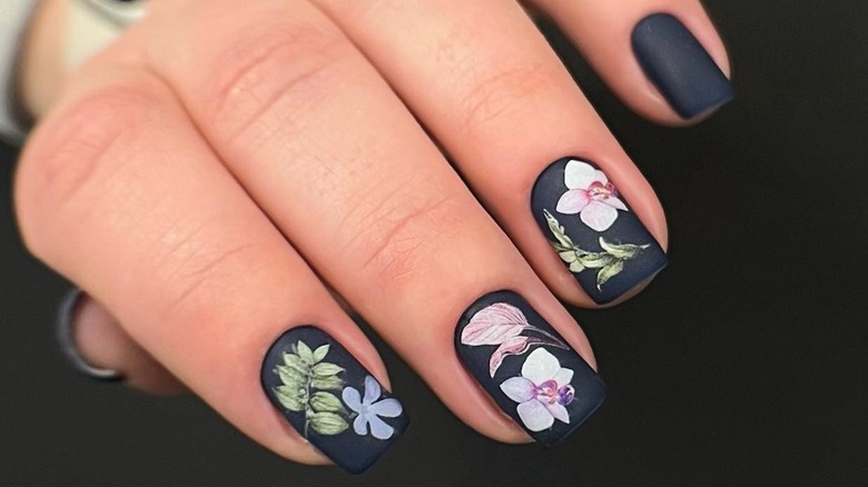 Matte black nails with flowers