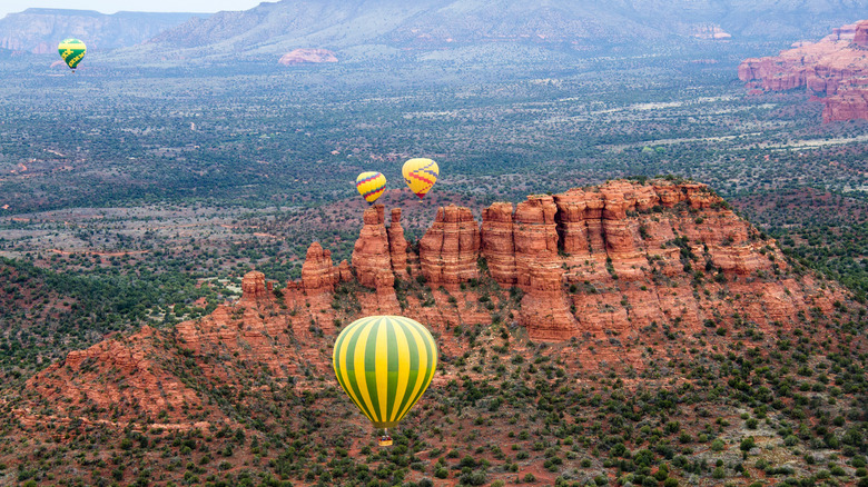 Hot air balloons flying above Sedona, Arizona's Red Rock Country