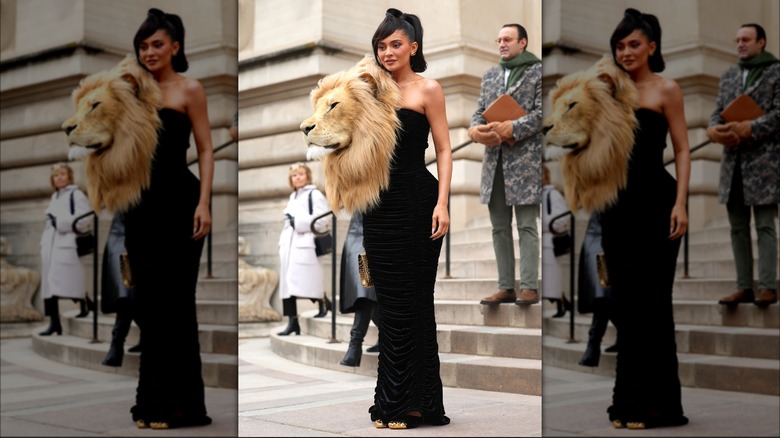 Kylie Jenner posing with a lion head