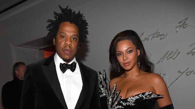 Jay-Z and Beyoncé posing at an event