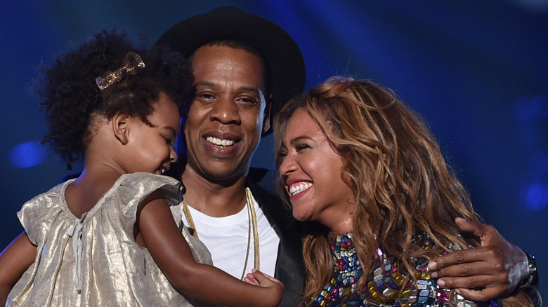 Blue Ivy Carter, Jay-Z, and Beyoncé smiling together