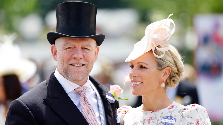 Closeup of Zara Tindall looking at Mike Tindall both in formal wear at Royal Ascot