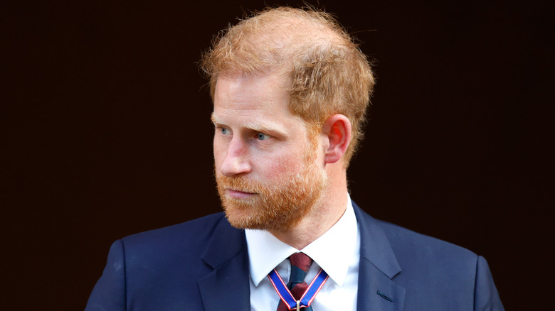 Closeup of Prince Harry looking over his right shoulder