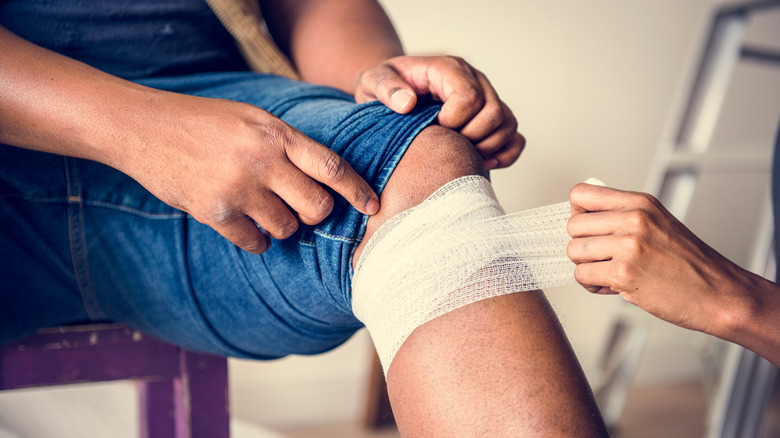 man with knee bandage