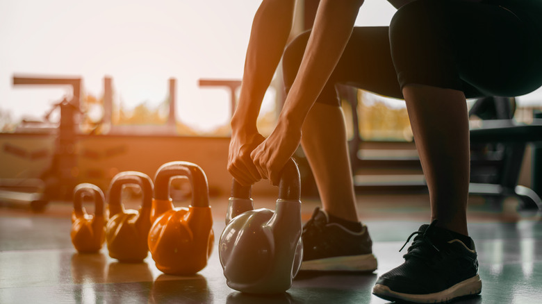 Woman working out with kettlebells