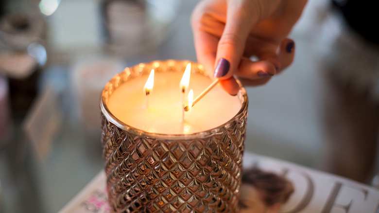 Women lighting a candle