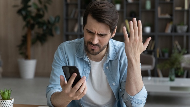 Man frustrated at his phone