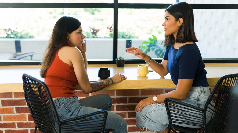 Two women in intense conversation 