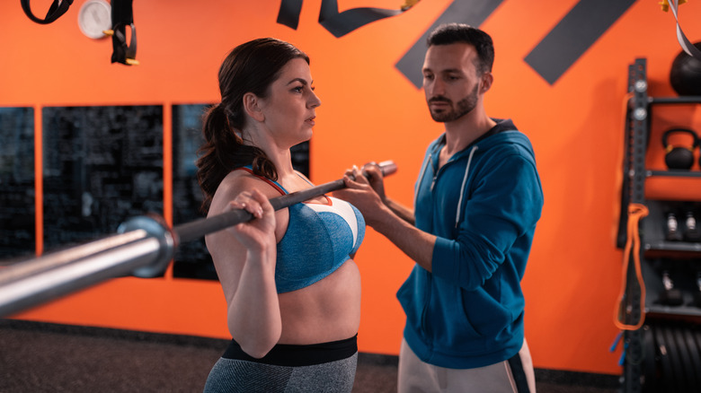 woman working out with a trainer