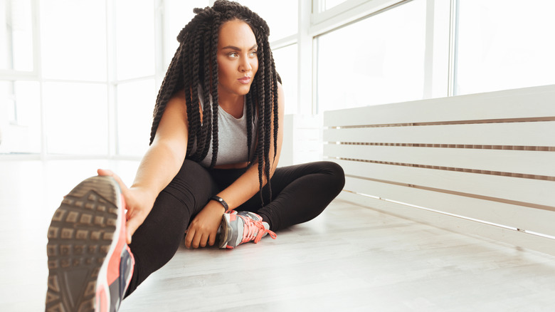 woman stretching morning