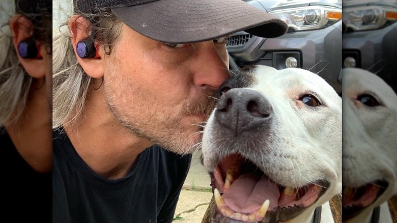 Steve Ford kissing his dog