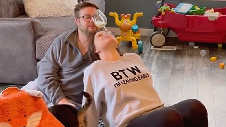 Amy King playing a wine game with husband Dillon King