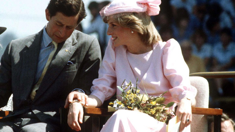 Charles and Diana hold hands