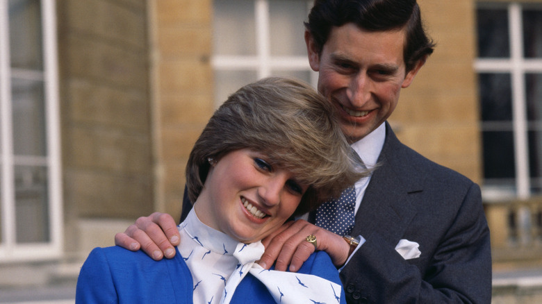 Charles rubs Diana's shoulders