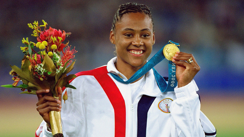 Marion Jones smiling with her medal