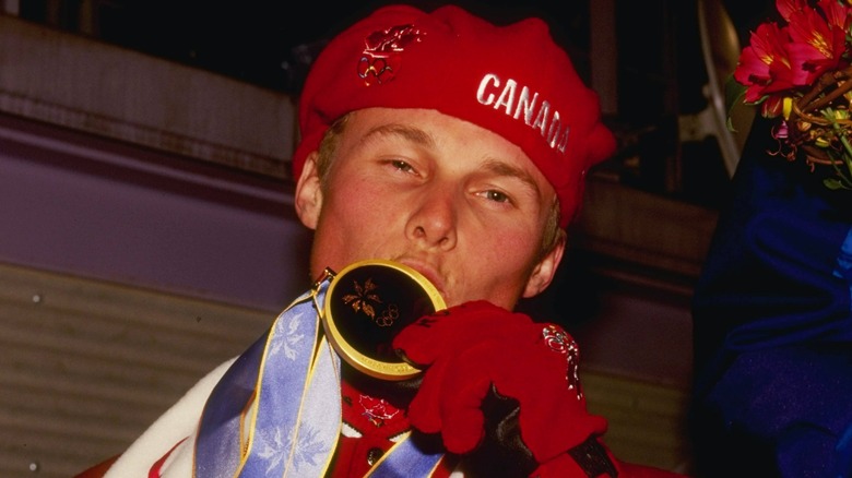 Ross Rebagliati kissing his medal 