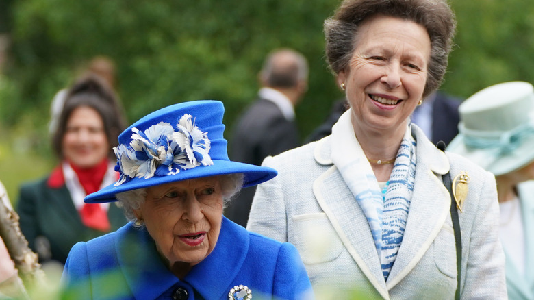 Princess Anne walking with Queen Elizabeth 