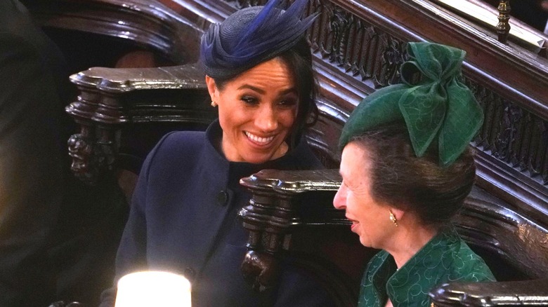 Princess Anne and Meghan Markle smiling and chatting 