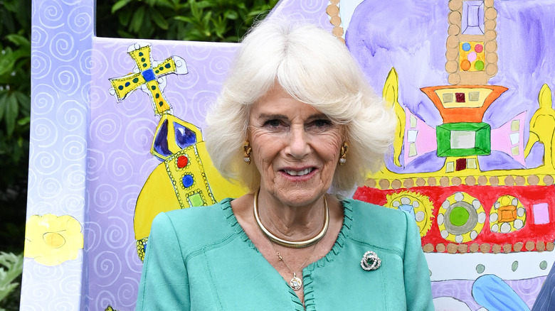 Queen Consort Camilla wearing turquoise