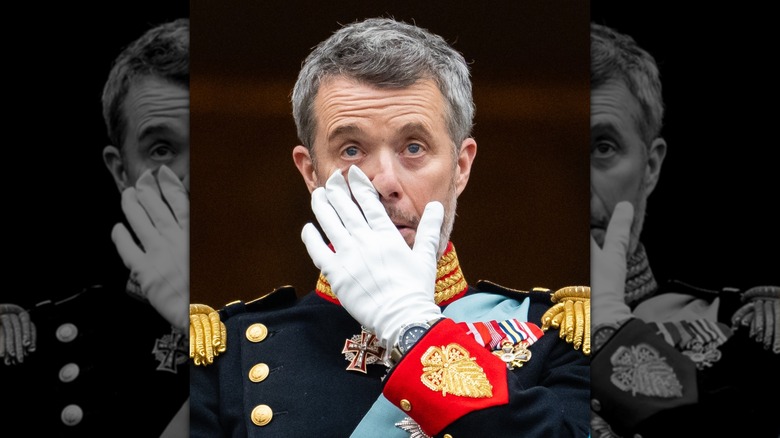 King Frederik X wiping away tears