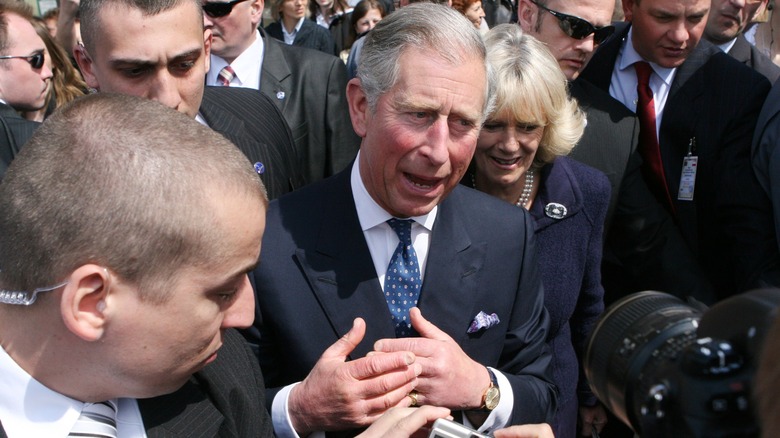 King Charles and Queen Camilla in crowd