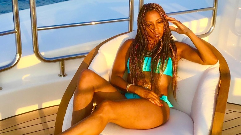 Holly Robinson Peete in golden light on boat