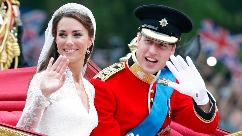 Kate Middleton & Prince William waving in carriage on wedding day