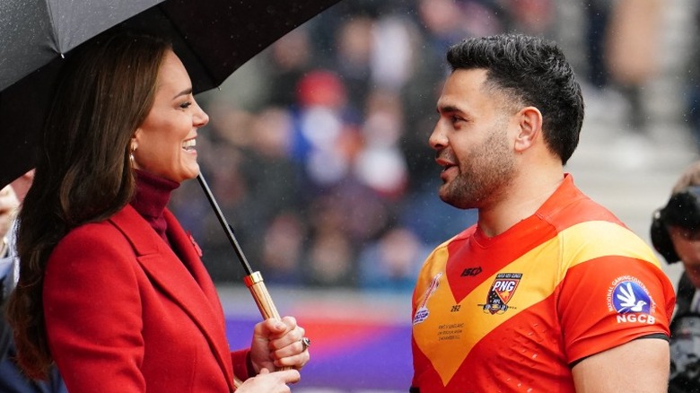 Kate Middleton umbrella rugby player