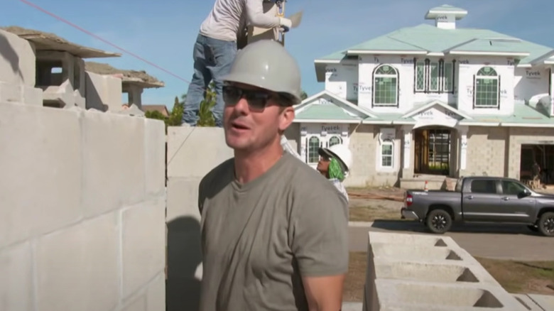 Brian Kleinschmidt building wearing hardhat