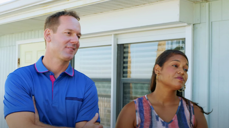 Brian and Mika talking to homeowners