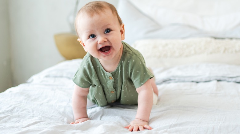 Baby crawling in bed