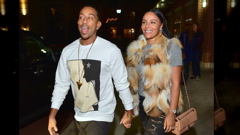 Ludacris walking with Eudoxie Mbouguiengue