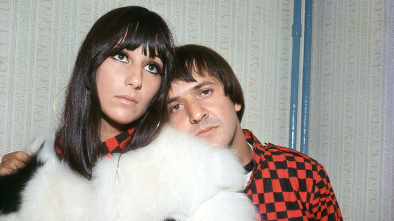 Sonny & Cher 1966. Cher wearing white fur, sonny wears checkerboard pattern