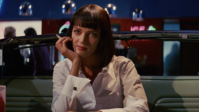 Mia Wallace holds cigarette 