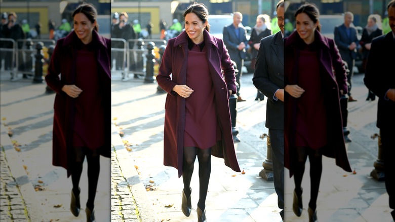 Meghan Markle in a burgundy dress while pregnant