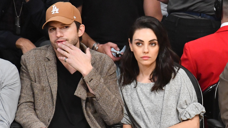 Ashton Kutcher and Mila Kunis sitting