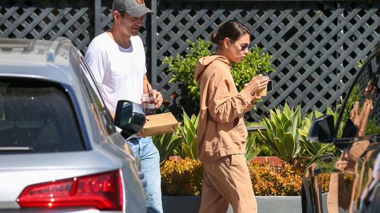 Ashton Kutcher and Mila Kunis walking