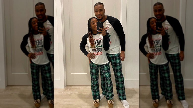 Simone Biles and Jonathan Owens in pjs taking selfie