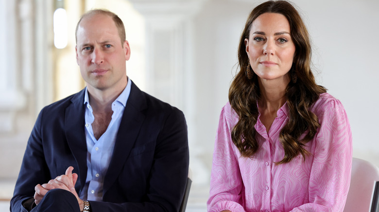 Prince William and Princess Catherine frowning 