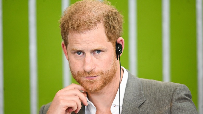 Prince Harry wearing an earbud