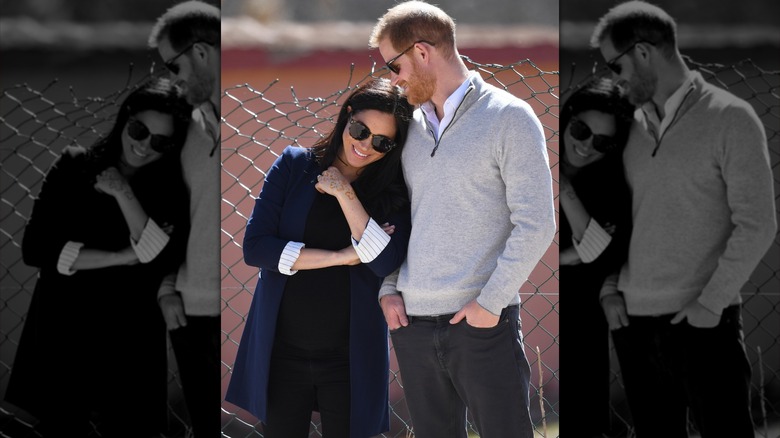 Meghan Markle leaning on Prince Harry